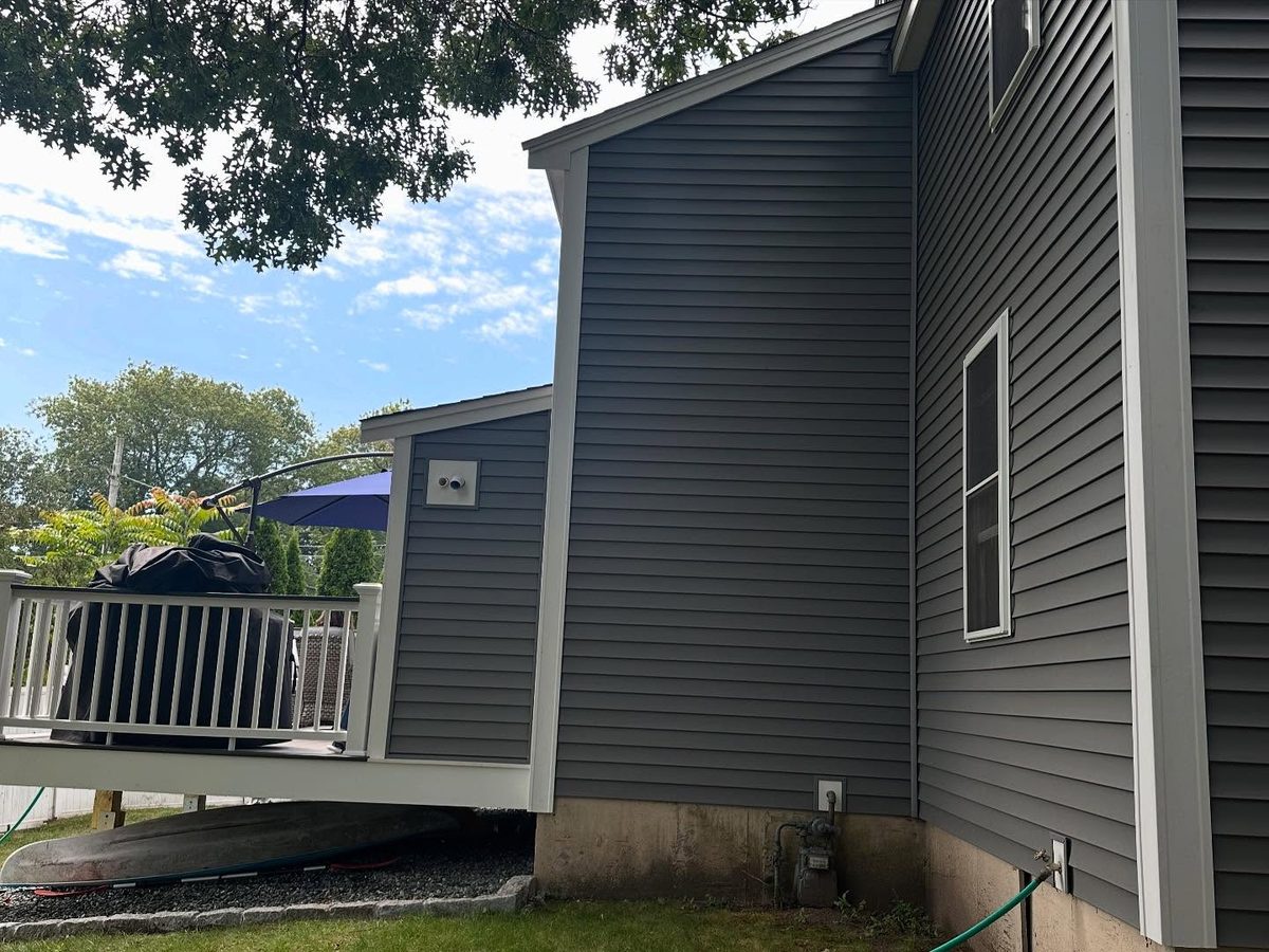 New siding detail at the rear corner and deck