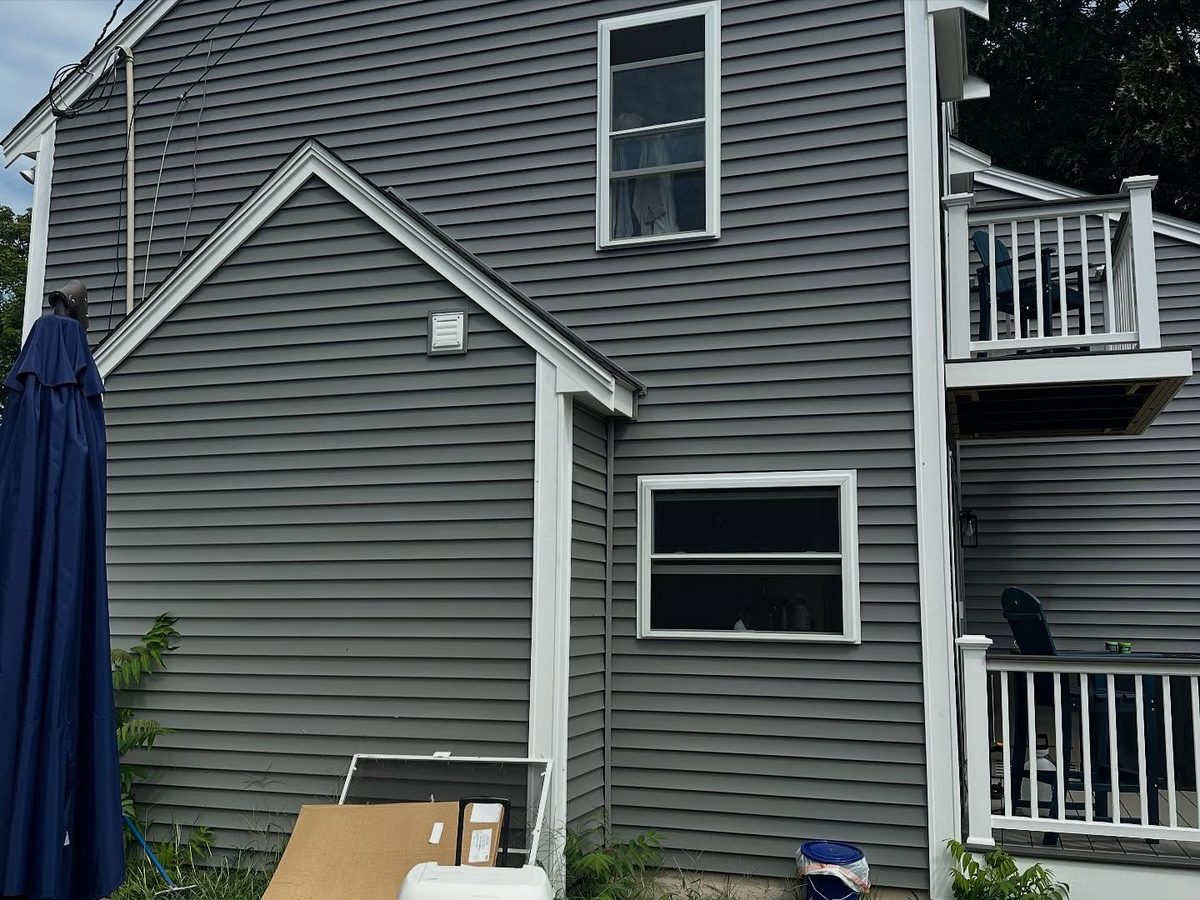 New siding and window trim at the side gable