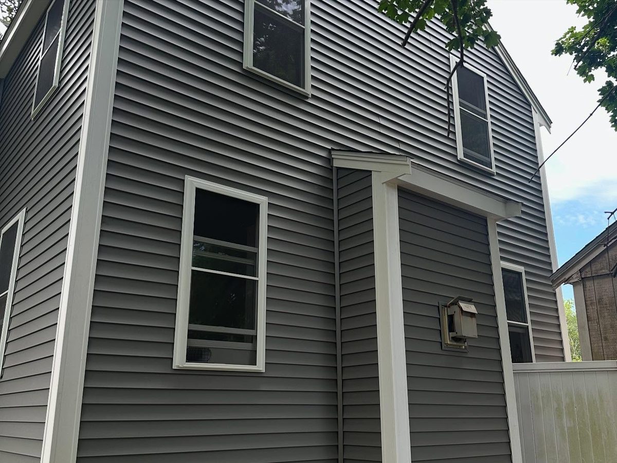 New siding, corner boards, and window trim