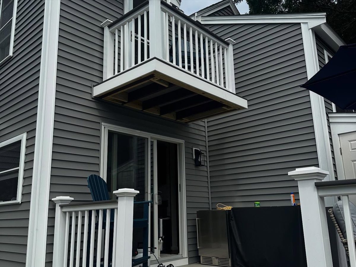 New balcony over the patio door with finished trim