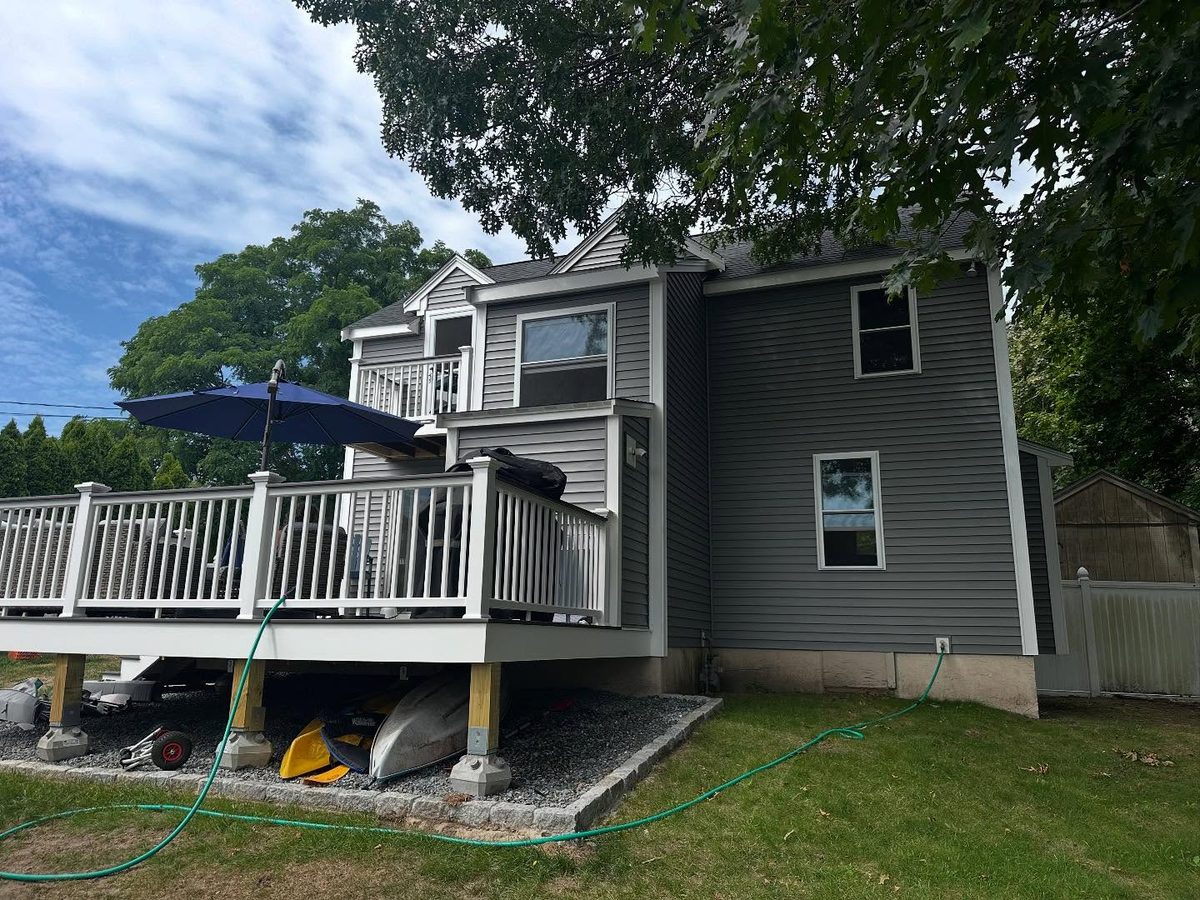 Back right side after the re-side with new siding and deck